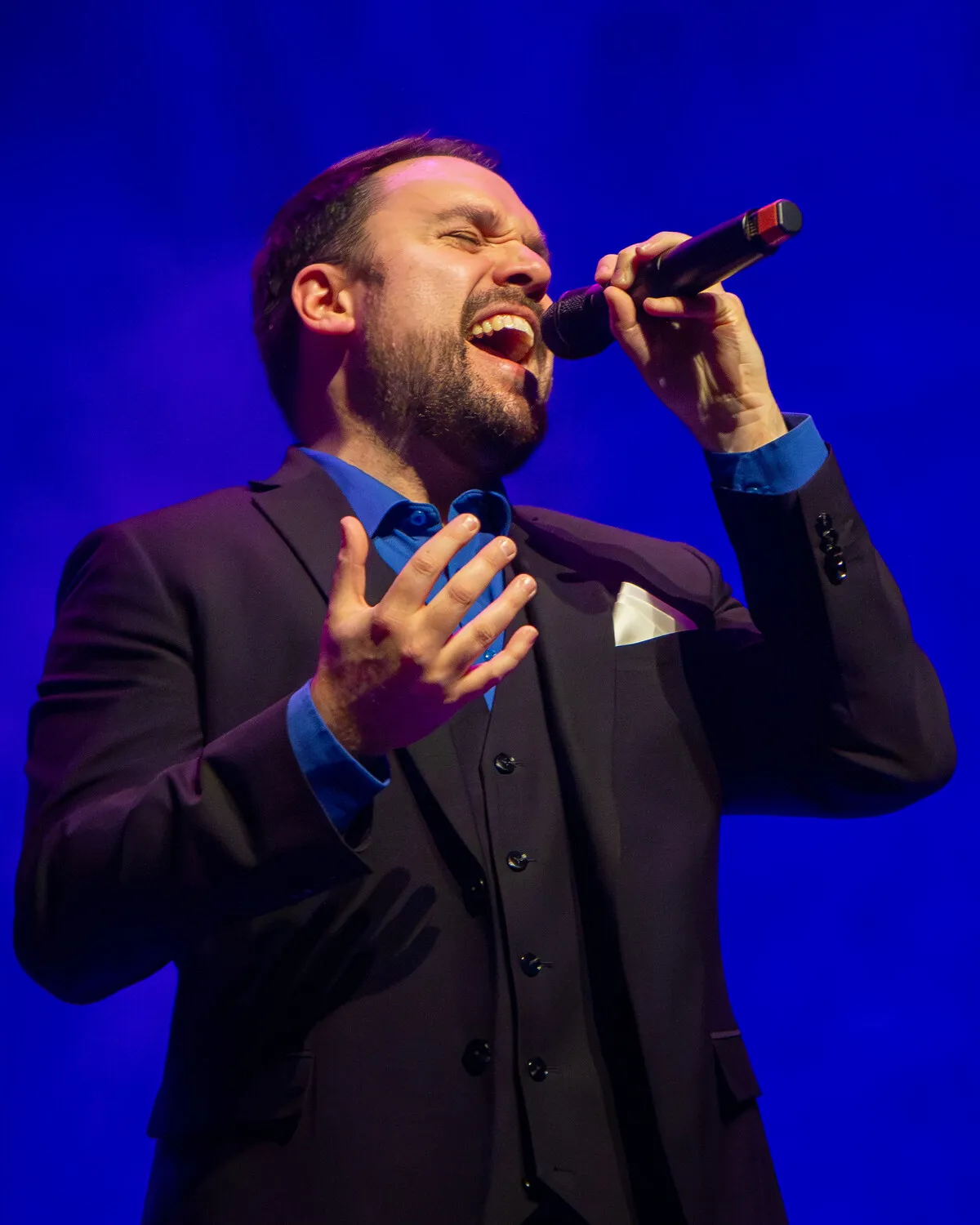 Bryan LeGrow of 6 Minute Warning singing on stage