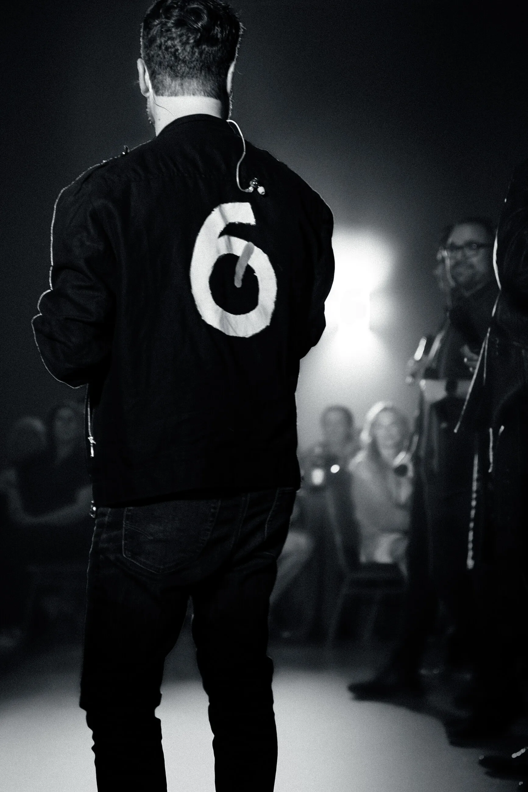 6 Minute Warning press photo: brett from behind in the 6 jacket